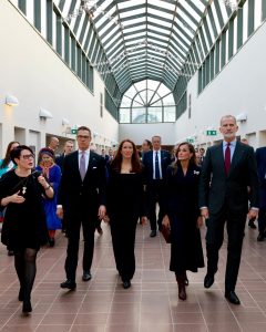 King Felipe VI and Queen Letizia of Spain walking with Finnish President Alexander Stubb and First Lady Suzanne Innes-Stubb through a glass-roofed hall in Rovaniemi during the state visit to Finland